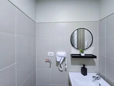 a white bathroom with a sink and a mirror at 1BR Condotel with Balcony at FAME Residences #FM45-1 in Manila