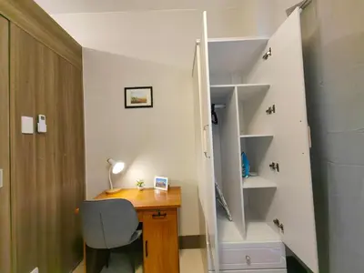 a desk with a chair next to a staircase at 1BR Condotel with Balcony at FAME Residences #FM51-1 in Manila
