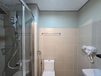 a bathroom with a shower and a toilet and a sink at 1BR Condotel with Balcony at FAME Residences #FM48-1 in Manila