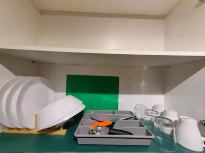 a kitchen with a counter with a sink and dishes at 1BR Condotel with Balcony at FAME Residences #FM53-1 in Manila