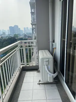 a balcony with a toilet on the side of a building at Lumiere Residences in Manila