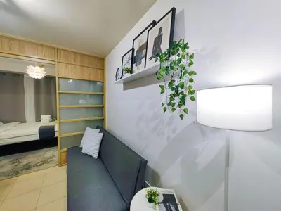 a living room with a couch and a bed at 1BR Condotel Ridgewood Towers Near Airport #RW03-1 in Manila
