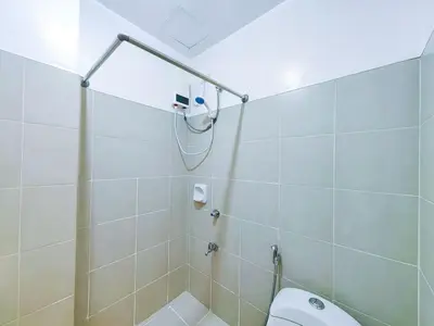 a bathroom with a shower and a toilet at 1BR Condotel Ridgewood Towers Near Airport #RW03-1 in Manila