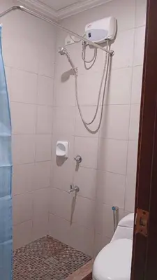 a bathroom with a shower with a toilet at 1BR Condotel Ridgewood Towers Near Airport #RW05-1 in Manila