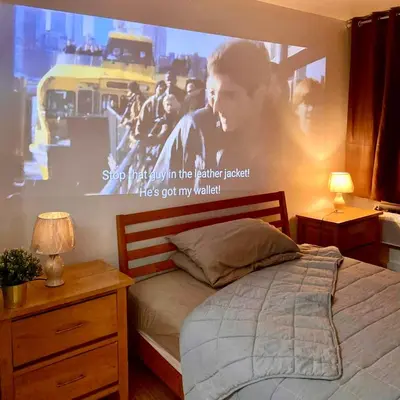 a bedroom with a large poster on the wall at Casa Kalma - Beach View Staycation in Manila