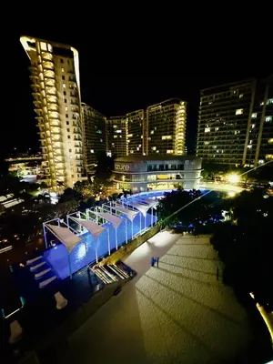 a view of a city at night with buildings at Casa Kalma - Beach View Staycation in Manila