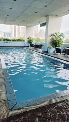 a swimming pool in the middle of a building at 2BR 90sqm Furnished Condo Shaw Blvd, Mandaluyong in Manila