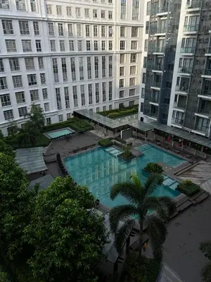 an overhead view of a large building with a swimming pool at L&D Condominium in Manila