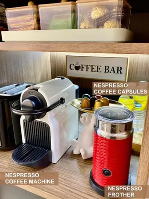 a coffee machine on a shelf in a store at Modern Unit at Shore 2 Mall of Asia by Elle Suite in Manila