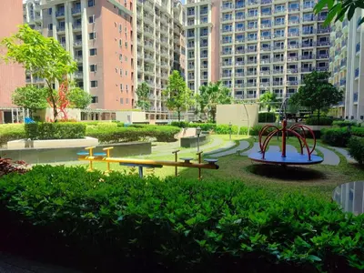 a playground in a city with tall buildings at Condo near Moa with Pool Access WS1205 in Manila