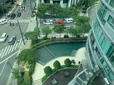 an aerial view of a pool with trees and a street at Avant at the Fort 360 City Center views in BGC Taguig w Pool Access in Manila