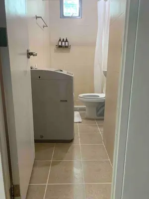 a bathroom with a sink and a toilet in it at Avant at the Fort 360 City Center views in BGC Taguig w Pool Access in Manila