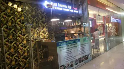a store with a bunch of bananas on the wall at 2BR Condo w Pool Loft at Fort Victoria BGC Taguig in Manila