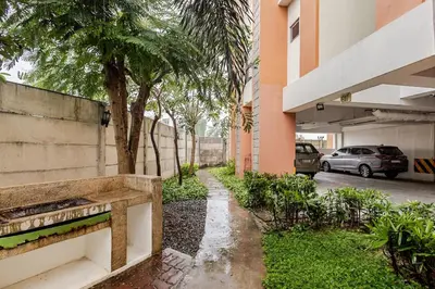 a sidewalk in front of a building with a parking lot at Self-Checkin - Piekny Dom - A Beautiful Home in Manila
