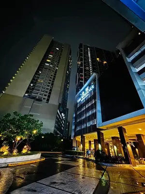 two tall buildings in a city at night at The Radiance Manila Bay - DF Sy 19J in Manila