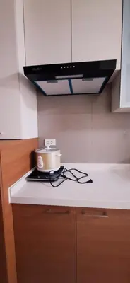 a pot sitting on top of a stove in a kitchen at 1Bedroom2603A Sunshine100Tower3 70Inches TV Pool Karaoke in Manila