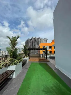 a green lawn on the roof of a building at 1Bedroom2603A Sunshine100Tower3 70Inches TV Pool Karaoke in Manila