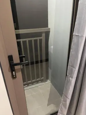 a door with a glass doorframe and a door with a window at S Residences MOA complex in Manila