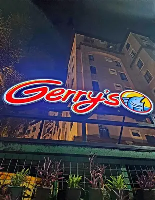 a large neon sign on the side of a building at Gallardo Condo Stays at Eighty One Newport Boulevard Newport City, Pasay City near NAIA Terminal 3 in Manila