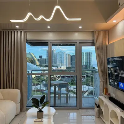 a living room with a view of a city at Panoramic Landscape Seaview, 2BR, near Airport, 11m in Manila