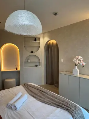 a bedroom with a bed with a large pendant light at Panoramic Landscape Seaview, 2BR, near Airport, 11m in Manila