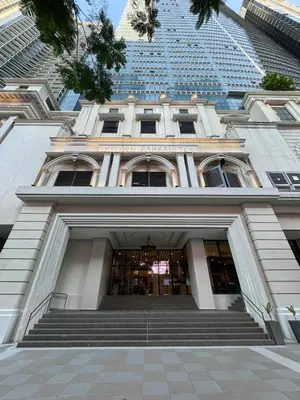 a building with stairs in front of a tall building at Stylish 1br inside BGC at Uptown Parksuites - 24k in Manila