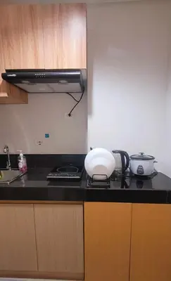 a kitchen with a counter top with a appliance on it at Leaf residences condotel 2bedroom Muntinlupa in Manila