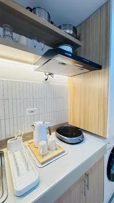 a kitchen with a counter top with a stove at Student Hub at DLSU in Pasong Bayog