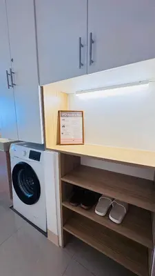 a kitchen with a washer and a washing machine at Student Hub at DLSU in Pasong Bayog