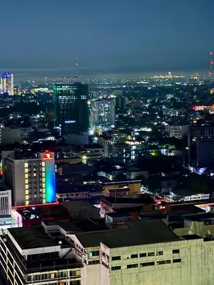 a view of a city at night at HAVEN on the 28th in Manila