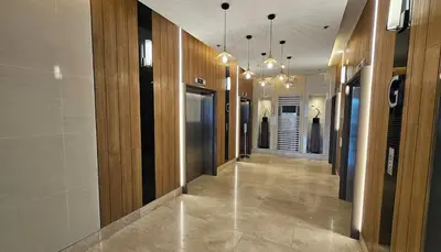 a hallway in a building with wooden walls and a hallway with a hallway at comfy 1 bedroom family condo in Manila
