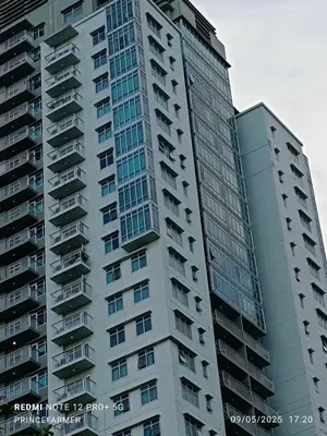 a tall building with balconies on the side of it at 1 Bedroom Red Oak Serendra BGC in Manila