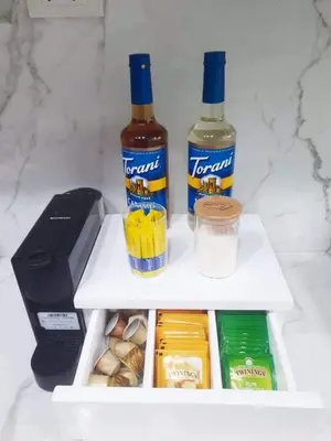 a refrigerator with two bottles of alcohol and snacks at Alabang Condos by Emma in Manila