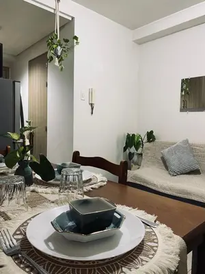 a dining room table with a plate on top of it at Shore Escape PH in Manila