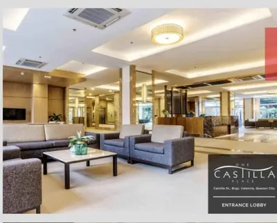 a lobby with couches and a table in a building at Peaceful City View Condo for Rent in Quezon City in Manila