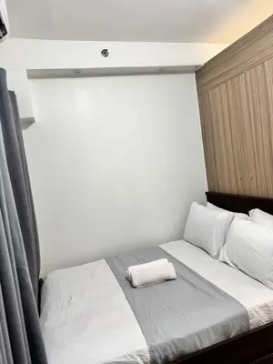 a bedroom with a bed with a pillow on it at Del Rosario Place Shore 2 Residence in Manila