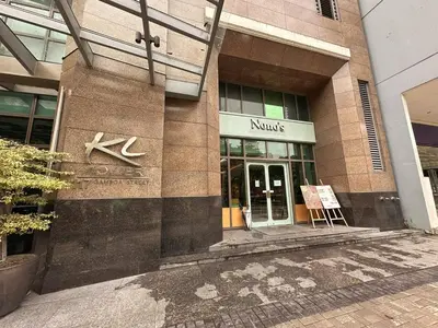 a kinks building with a sign in front of it at Private Unit at KL Tower Residences near Greenbelt Makati in Manila