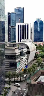 a view of a city with buildings and cars at Elite Pod Manila in Manila