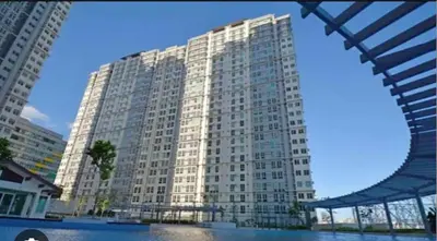 a large white building with a lot of windows at Phebs 2bedroom Posh Condo in the heart of Makati in Manila