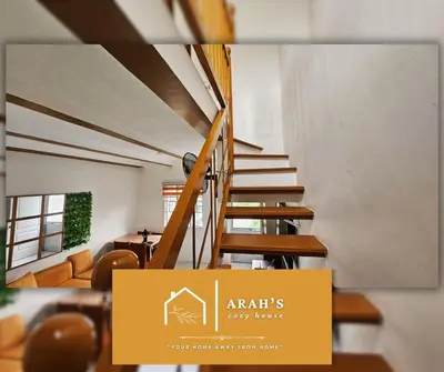 a staircase in a house with a sign that says ararts baby home at Arah Cozy House in Dasmariñas
