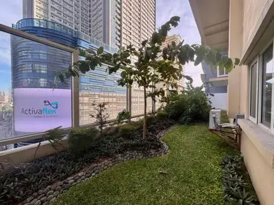 a balcony with a tree on the side of a building at Urban Oasis Studio at Central District Makati in Manila