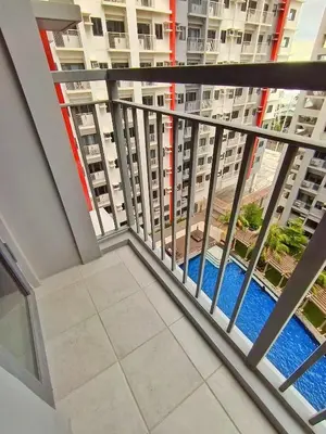 a balcony with a view of a building at Paean's Pods at Bloom in Manila