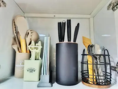 a group of utensils on a kitchen counter at Paean's Pods at Bloom in Manila