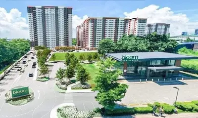 an aerial view of a park with tall buildings at Paean's Pods at Bloom in Manila
