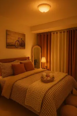 a bedroom with a bed with a bowl on it at Golden Hour Escape in Manila