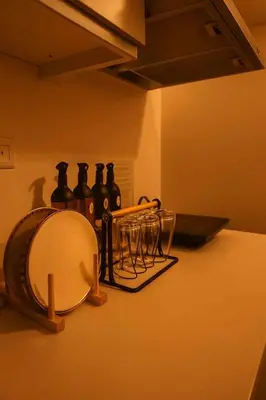 a group of bottles and glasses on a counter at Golden Hour Escape in Manila
