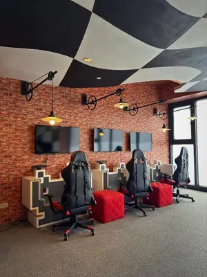 an office with three chairs and a brick wall at Sleek Designer Studio at Knightsbridge Residences in Manila