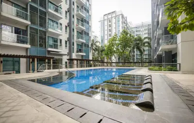 a swimming pool in the middle of a building at Airport View Walk to NAIA 3 in Manila