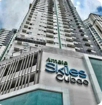 a tall building with a sign on the side of it at Amaia skies cubao in Manila