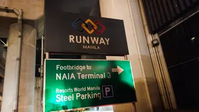 a street sign in front of a building at Your Home at One Palm Tree Villas near NAIA T3 in Manila